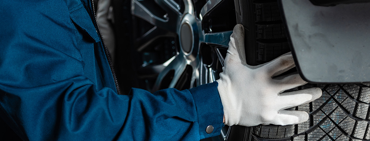 Up close shot of tire being replaced by technician