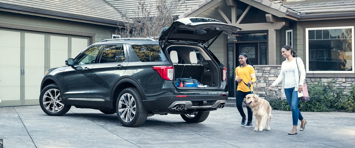 Family with dog packing their 2023 EXPLORER