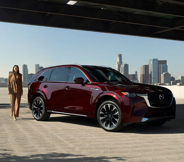 2024 CX-90 parked with a city in the background