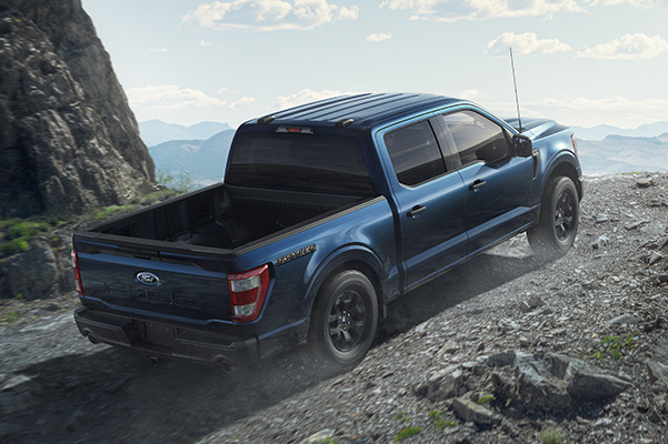 2023 F-150 Rattler climbing up rock trail.