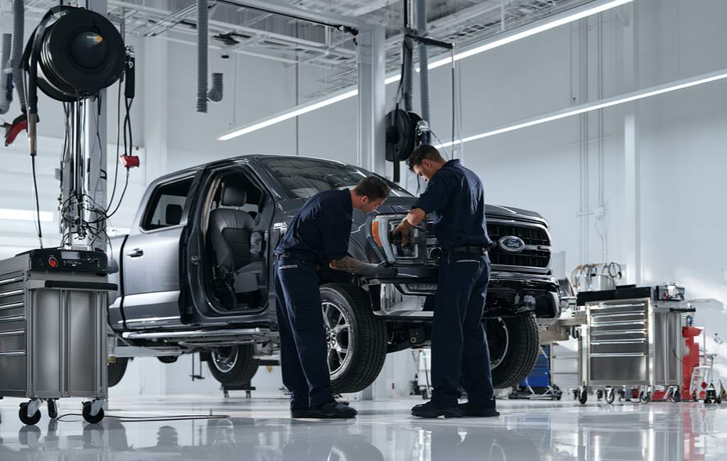 Technicians working on a pickup