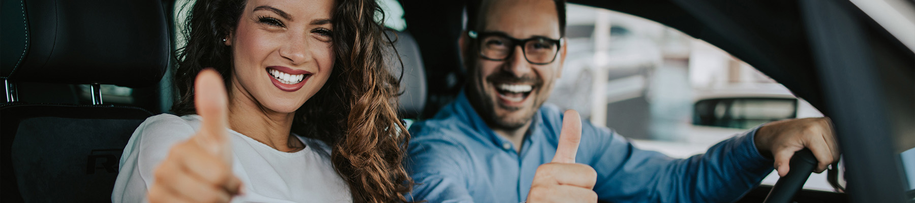 happy couple buying new car
