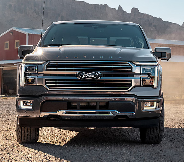 2025 Ford F-150® parked in front a barn and farm equipment