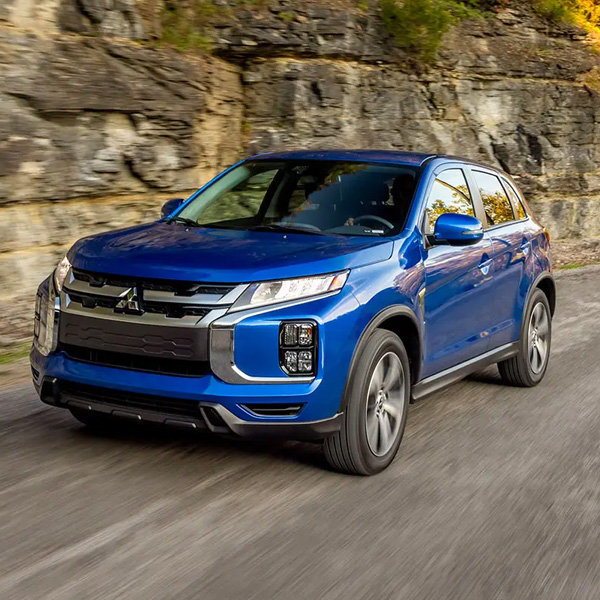 A blue 2024 Mitsubishi Outlander Sport SUV driving