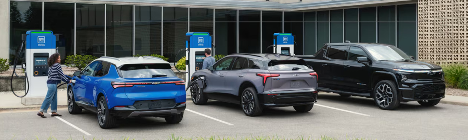 Lineup of Chevrolet EVs charging at station