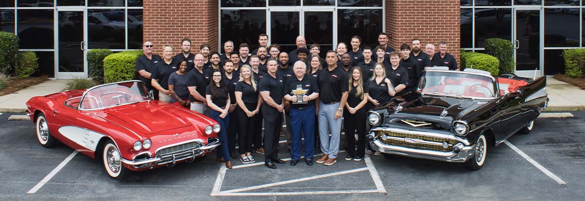 Lineup of employees at dealership