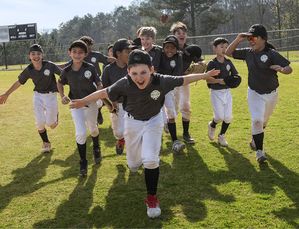 Kids playing baseball.