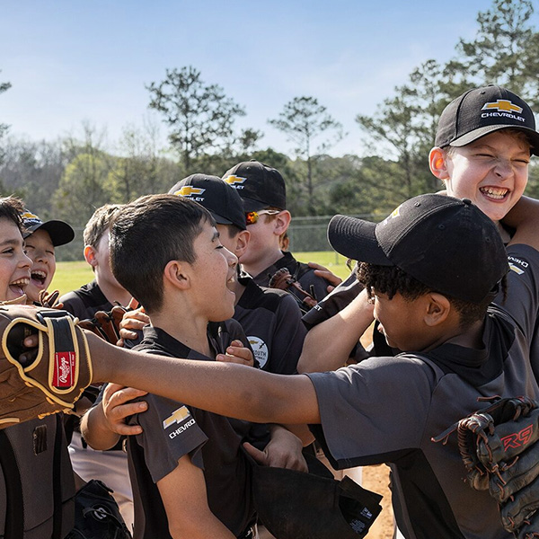 Kids playing baseball.